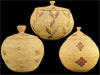 A group of three lidded Eskimo baskets