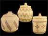 A group of three lidded Eskimo baskets