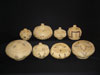 An array of Washo baskets with covers