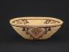 A Panamint bowl with designs in pink, yellow and blue