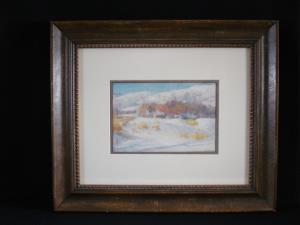 A framed painting by Joseph Henry Sharp